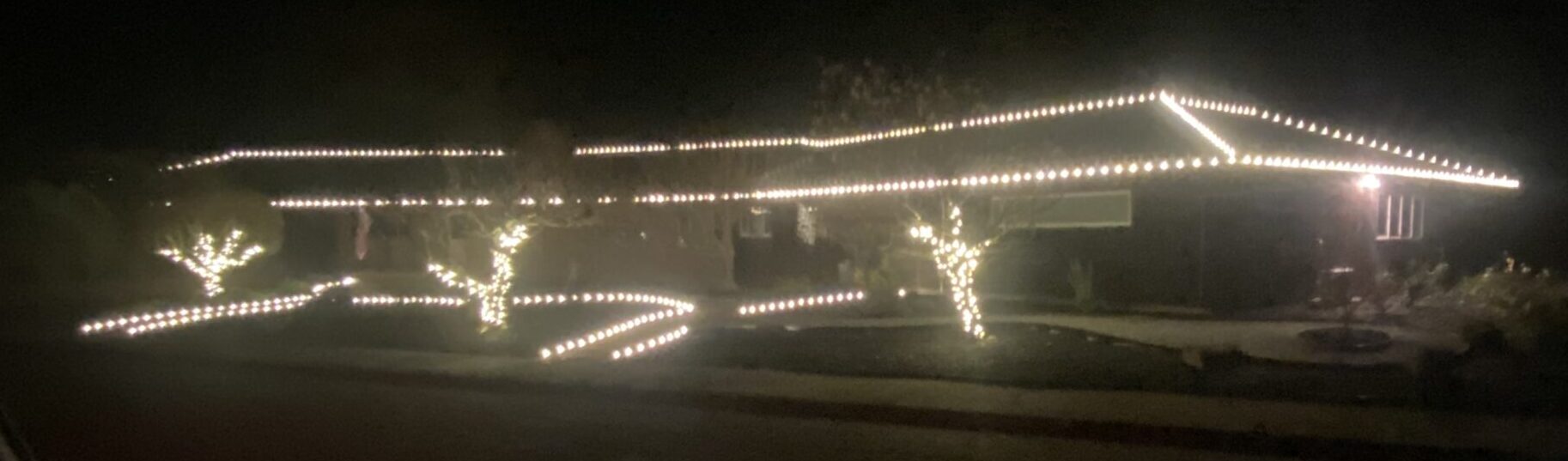 Classic multicolor C9 roofline around a ranch-style home